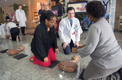 Doctor teaching CPR