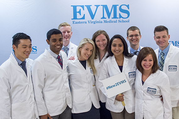 A group of new EVMS students pose for a photo during new student orientation.