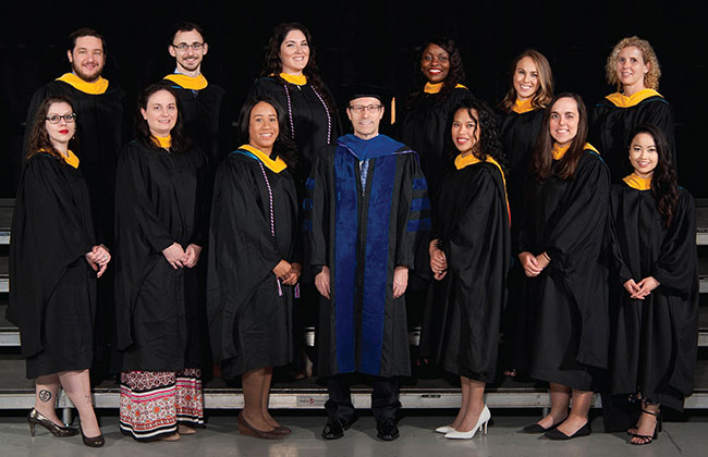 The inaugural Pathologists' Assistant graduating class poses for a graduation photo.