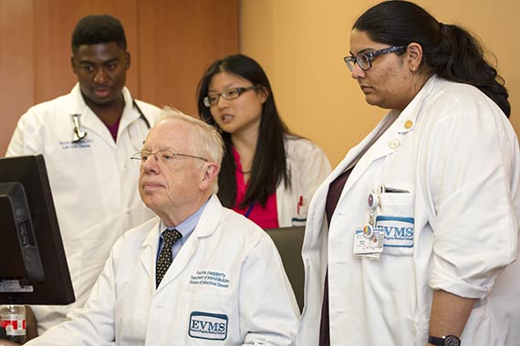 Dr. Patrick Haggerty and Infectious Disease fellows work together on examining patient cases.