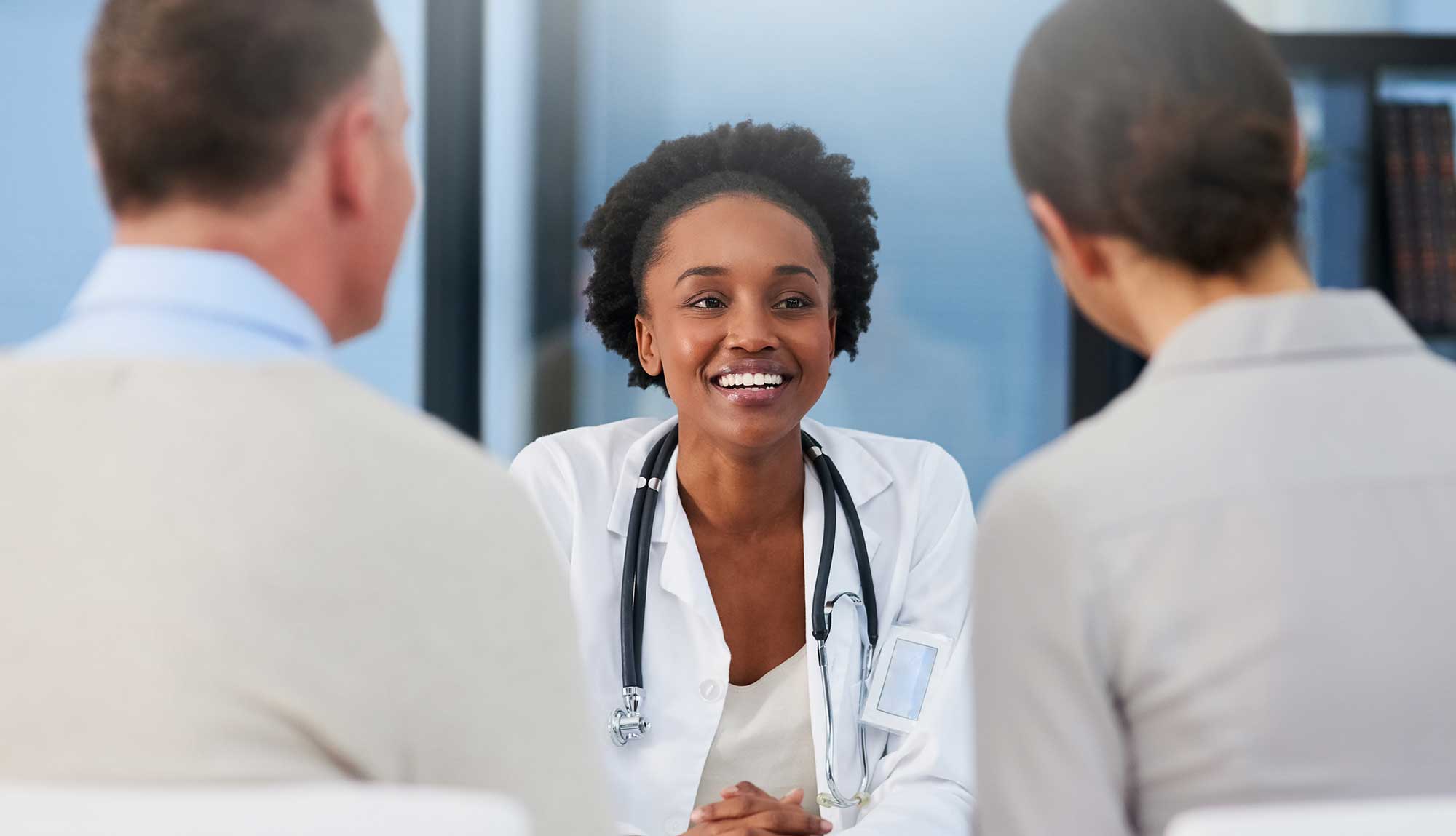 A reproductive endocrinologists consults with patients.