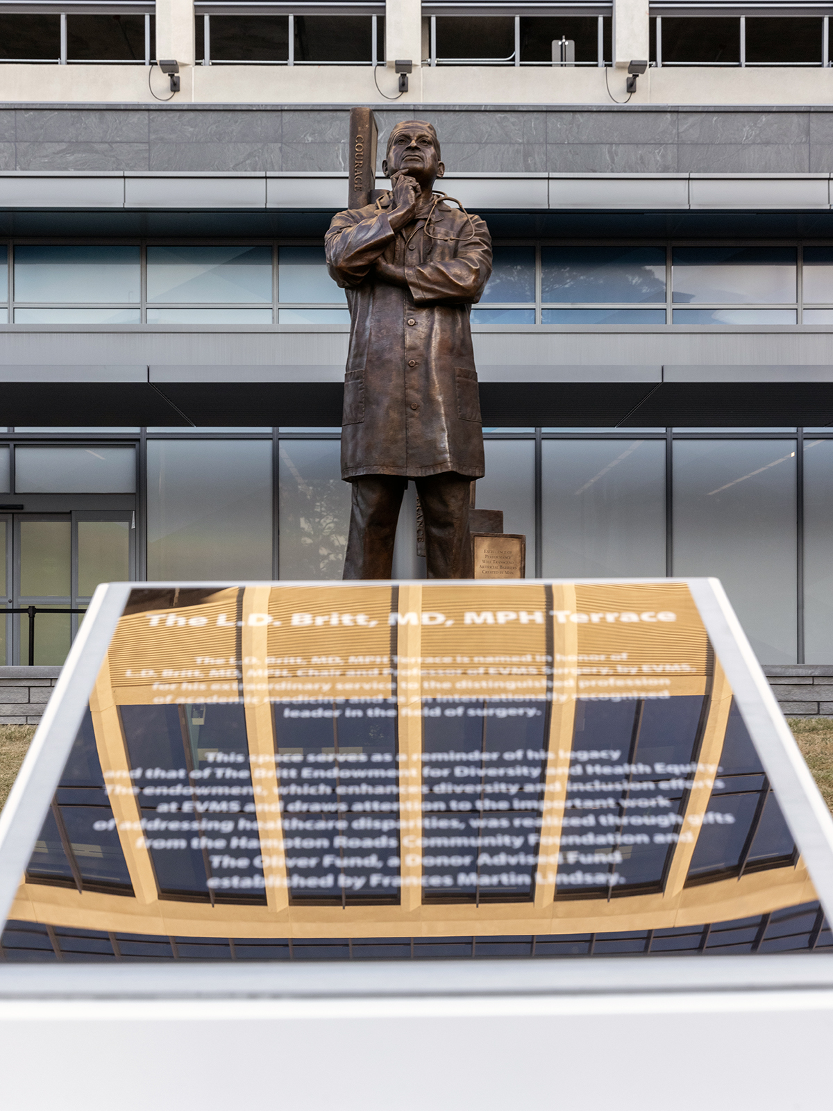 Picture of bronze statue in front of Waitzer Hall