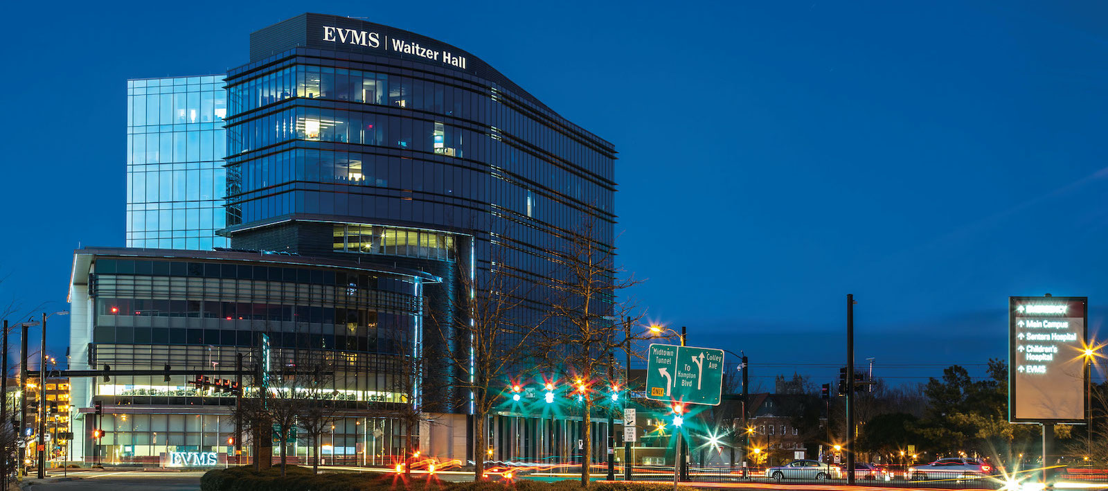 Nighttime view of EVMS' newest building, Waitzer Hall. The building is situated at the southeast corner of campus overlooking the busy intersection of Brambleton and Colley avenues. 
