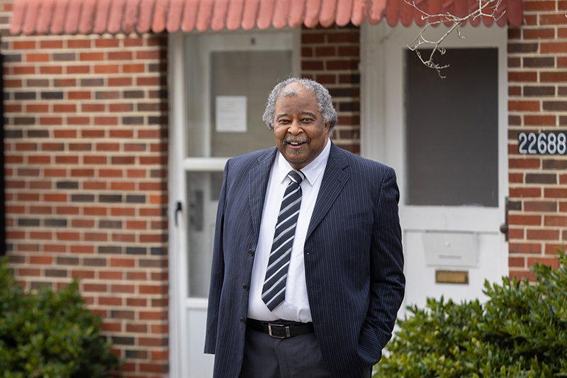 Image of Alvin Harris in front of a building in Western Tidewater.