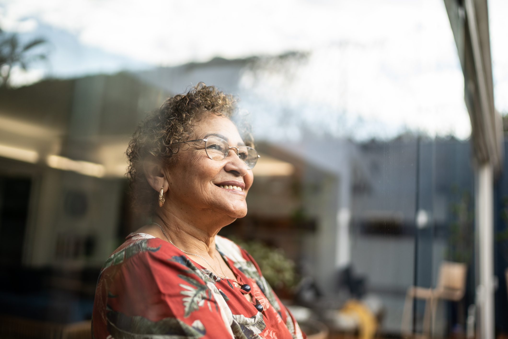 Woman looking out the window and smiling