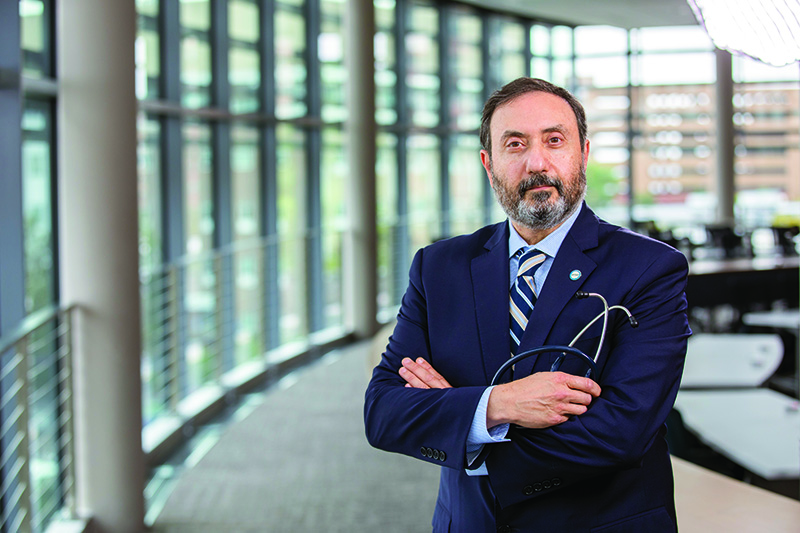 Dr. Abuhamad standing in Waitzer Hall.