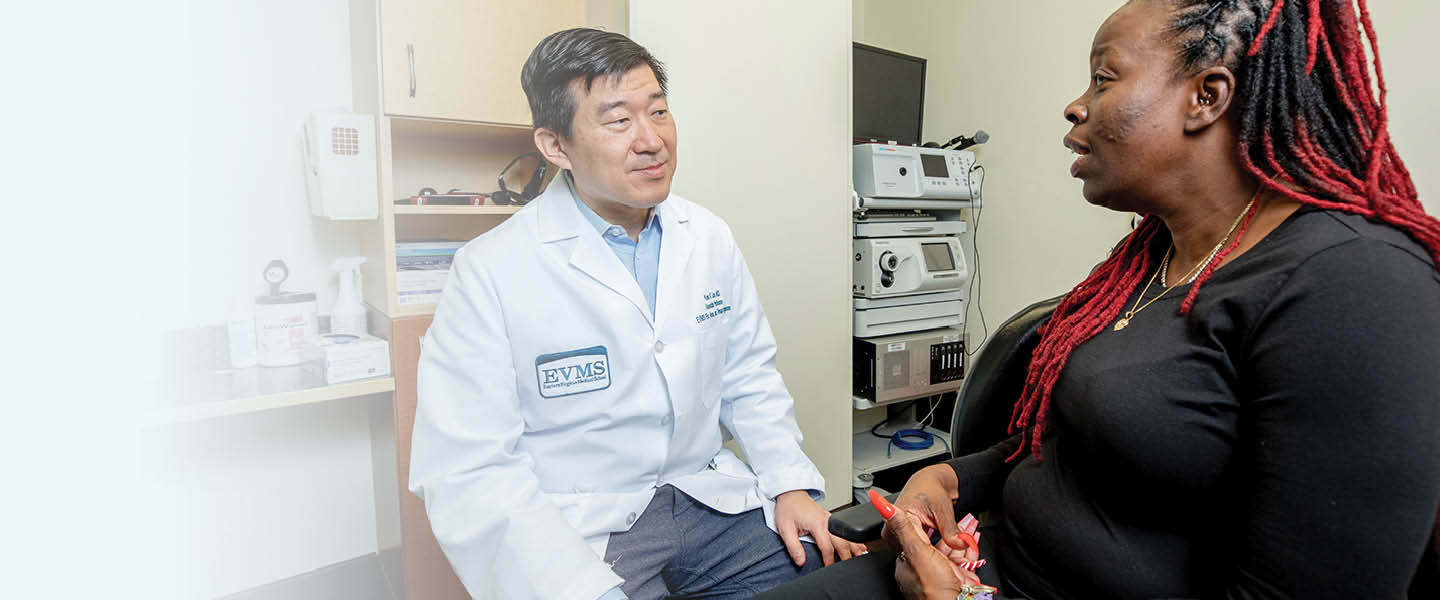 Dr. Lam speaking with a patient