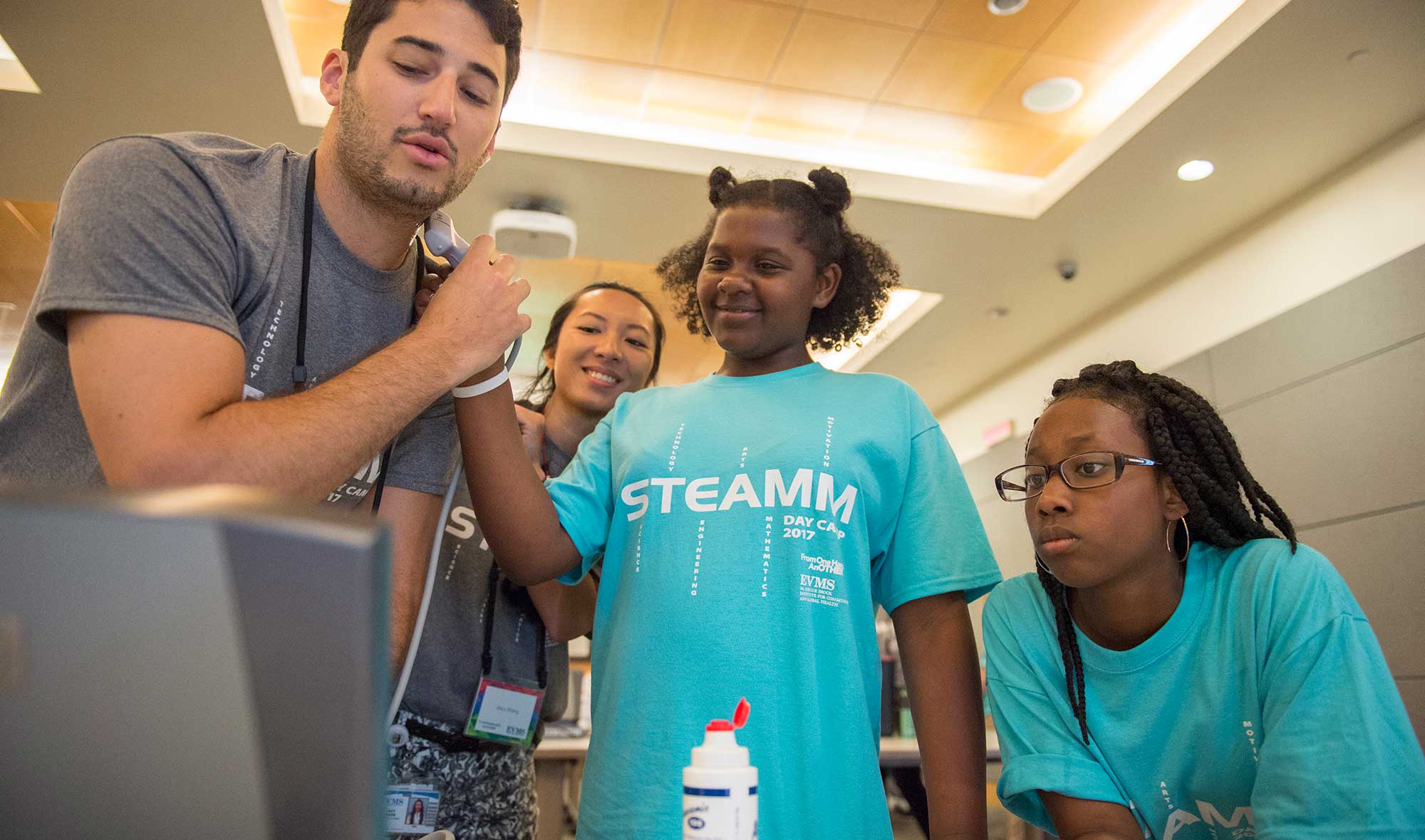 Students demonstrate the portable ultrasound.