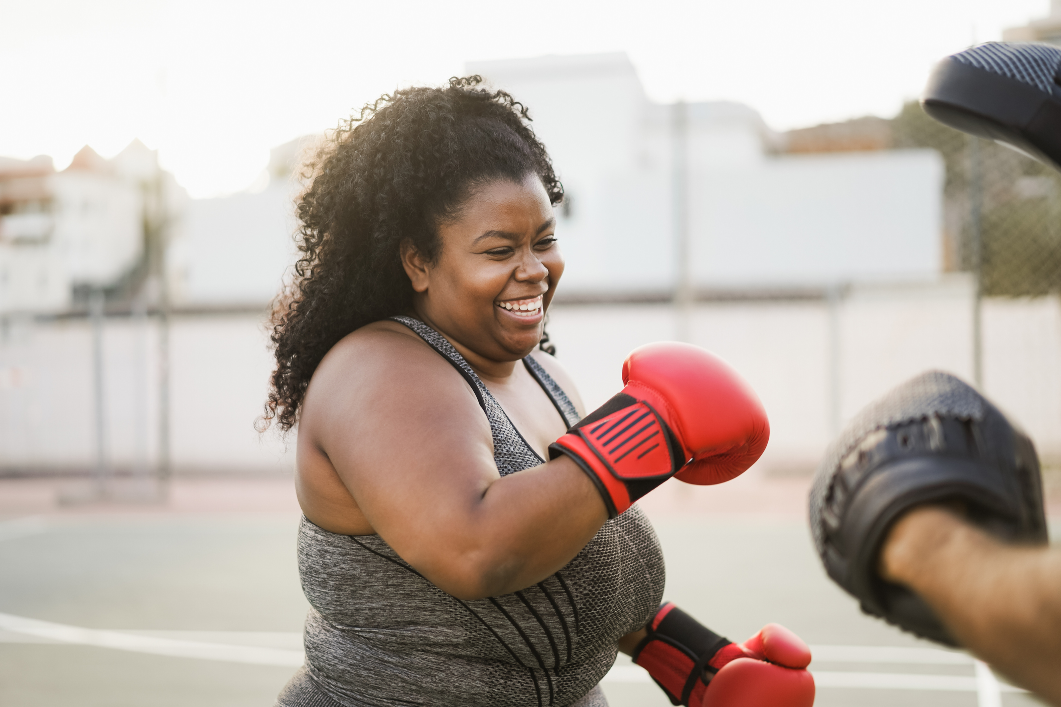 Black woman with red boxing gloves