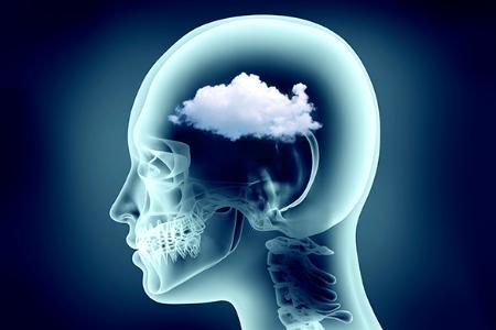 Illustration of a head with skull visible and a cloud where the brain would normally be
