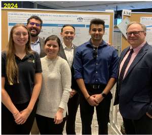 group shot of Musto and researchers