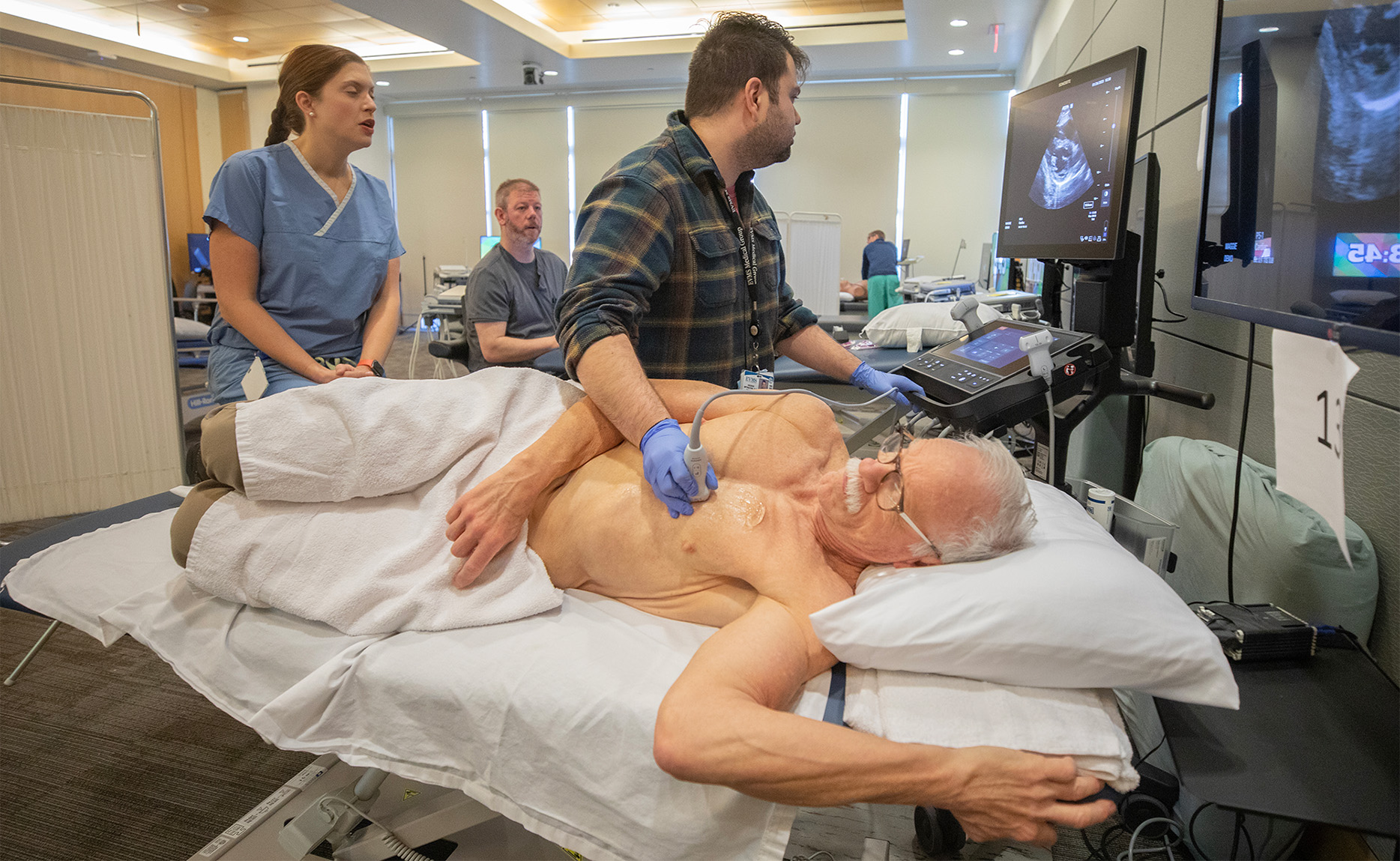 Patient on his side receiving ultrasound procedure