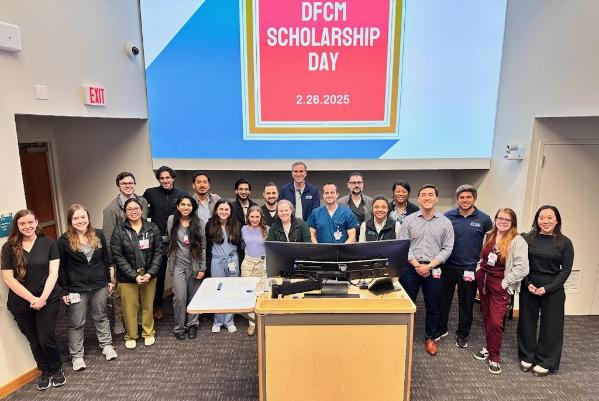 Group shot under DFCM Scholarship banner