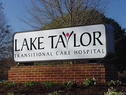 The sign for Lake Taylor Transitional Care Hospital in Norfolk, where our trainees work with patients.