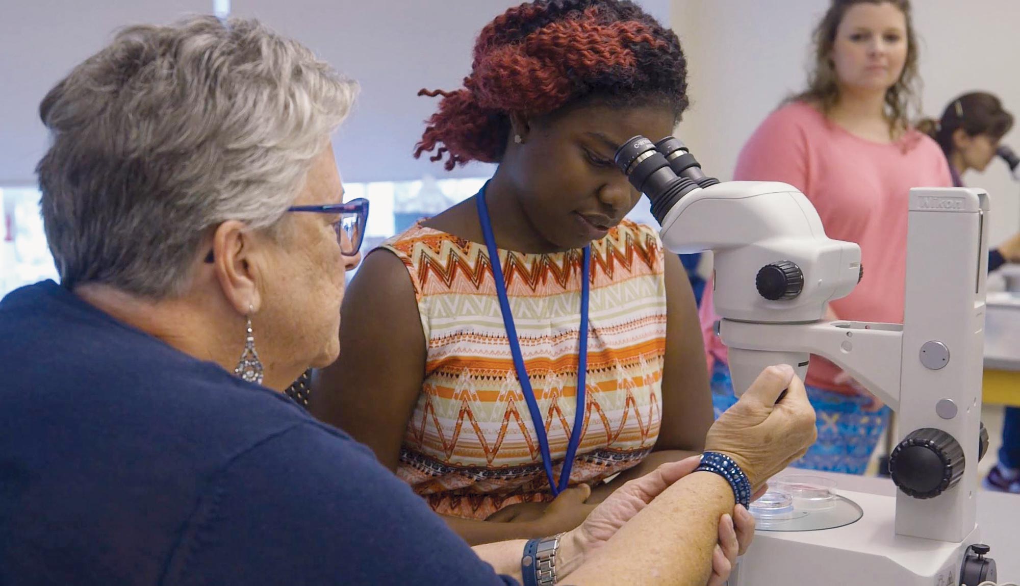 A student and faculty member work together during our on-campus clinical skills course.