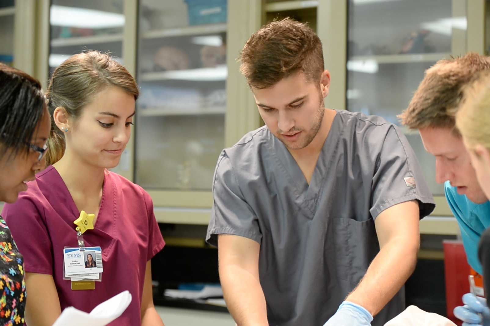 Medical Master's students hone their skills together in the lab.
