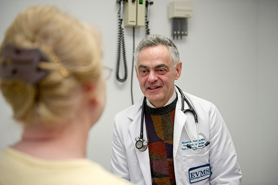 Dr. Robert Palmer talks with a patient