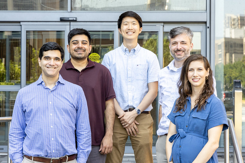 Five fellows stand facing the camera