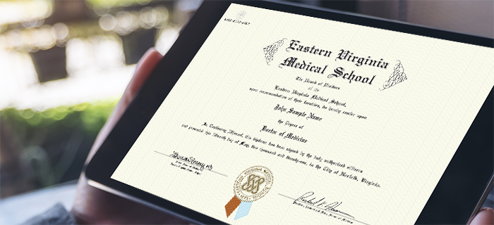 An image of a paper diploma in a frame with Eastern Virginia Medical School with an EVMS logo