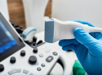 Ultrasound scanner probe in doctor's hand