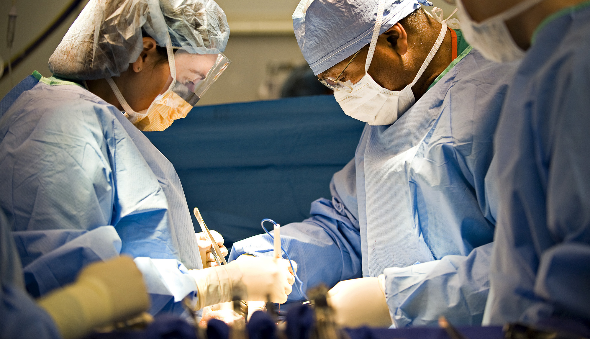 Dr. Britt and a team of EVMS surgeons operate on a patient.
