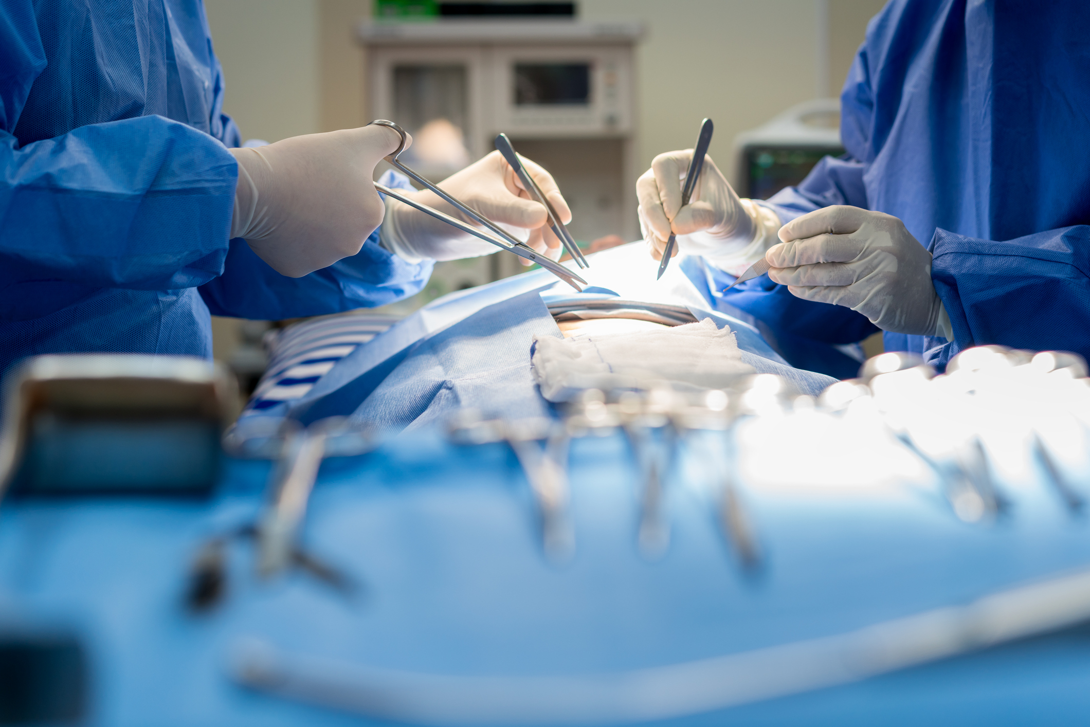 Surgeons performing a procedure in an operating room.