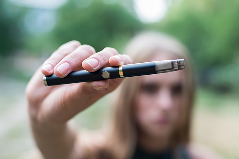 Teen with e-cigarette