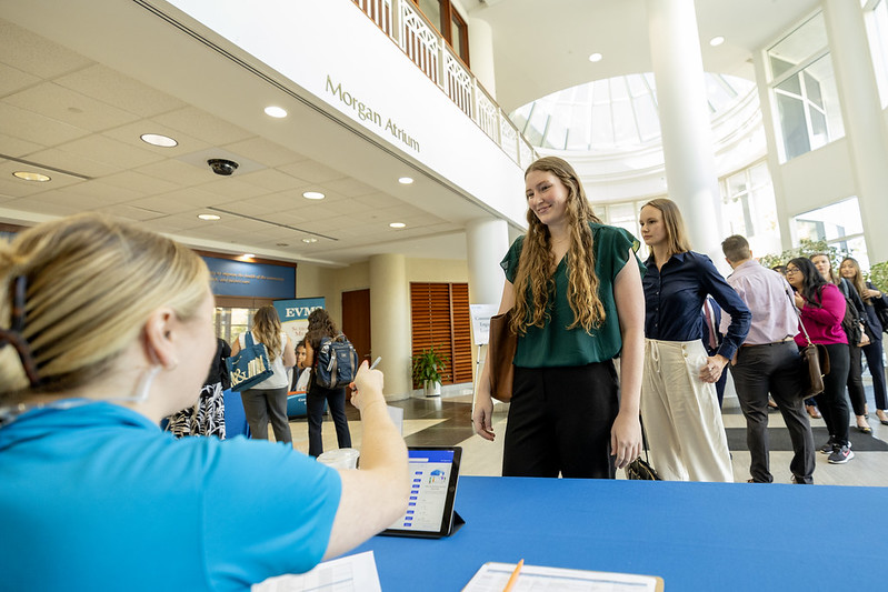 New students at a check-in table during orientation