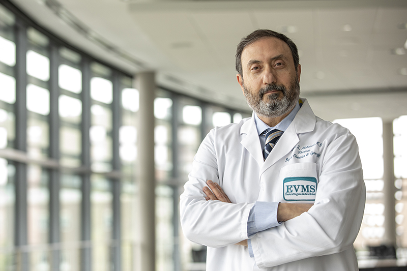 Alfred Abuhamad, MD, wearing white coat in Waitzer Hall