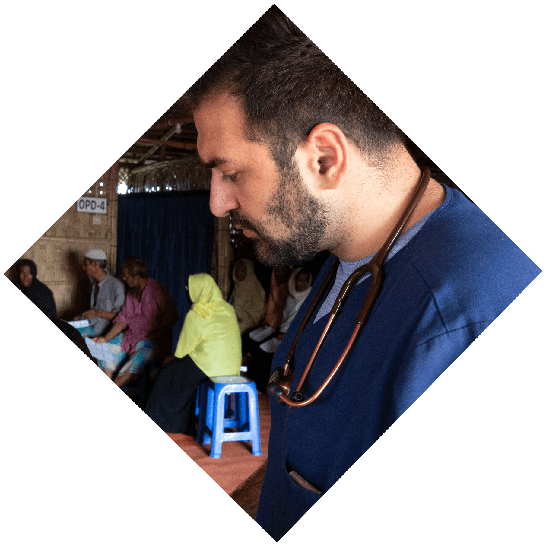 Samir Abu-Hamad, MD Class of 2020, works with one of the visiting doctors in the clinic.