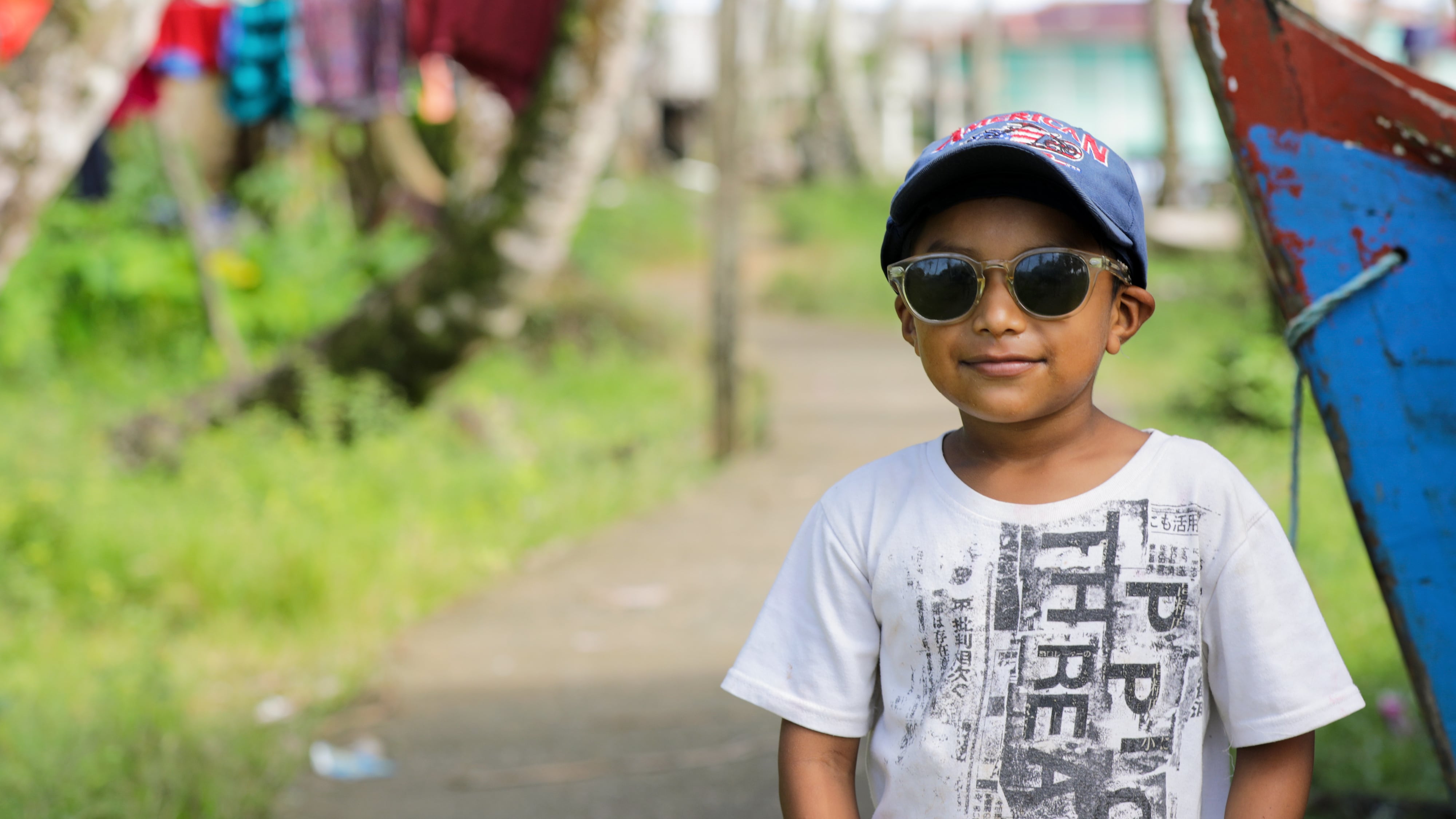 Child wearing sun glasses.