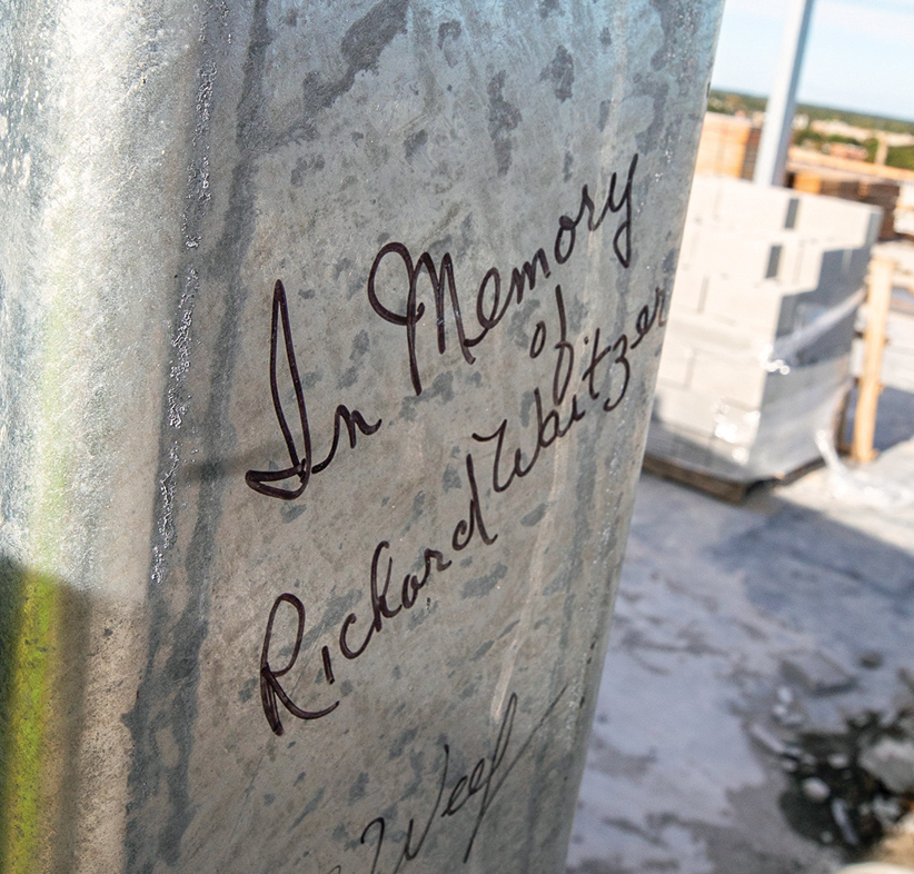 A pillar at the top of the building immortalizes Richard Waitzer, who died  in January 2019.
