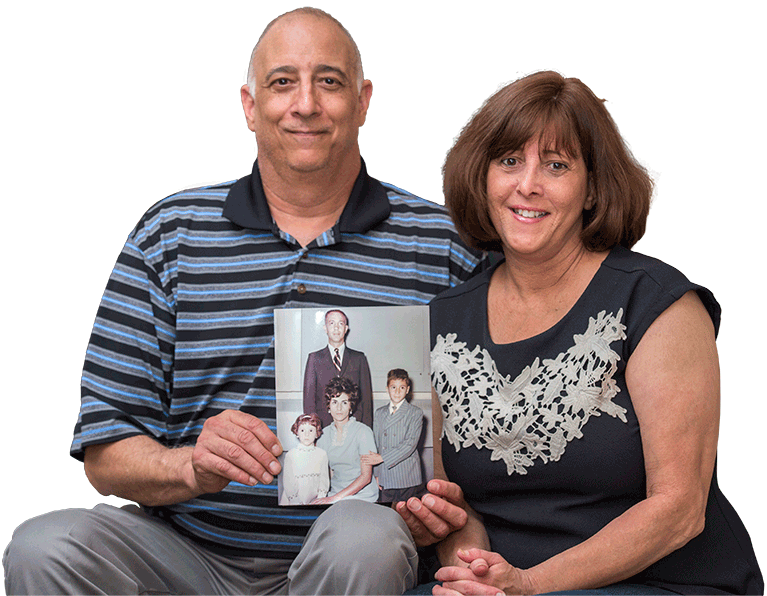 Kidney transplante receivers hold up a family photo