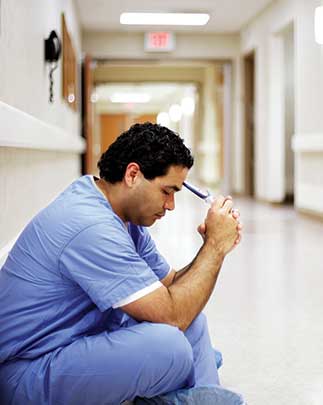Man sitting in a hallway