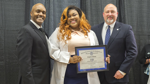 Surgical Assistant graduates hugging