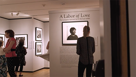 People viewing Labor of Love portrait exhibit