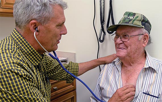 John O. 'Rob' Marsh, MD examines patient