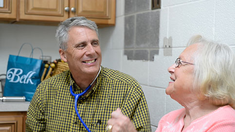 Dr. Marsh talks with a patient.