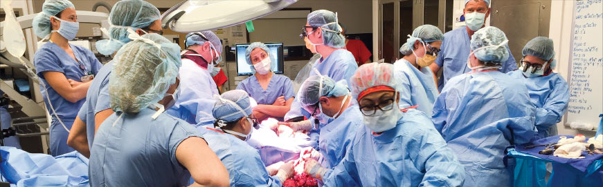 Surgeons performing elbow transplant